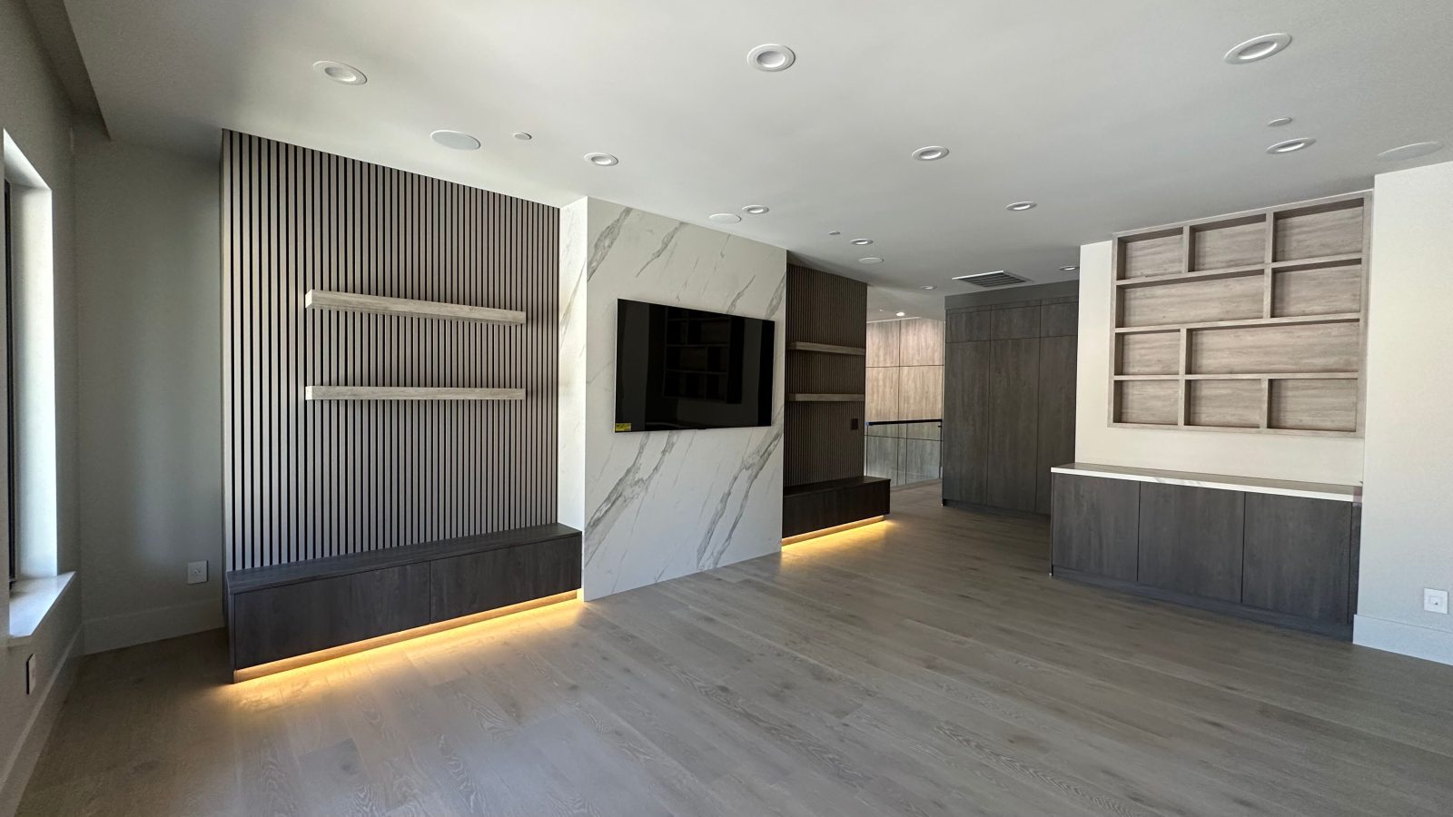 Gray Parallels acoustic wall panels and European Oak Como hardwood flooring in a modern living room