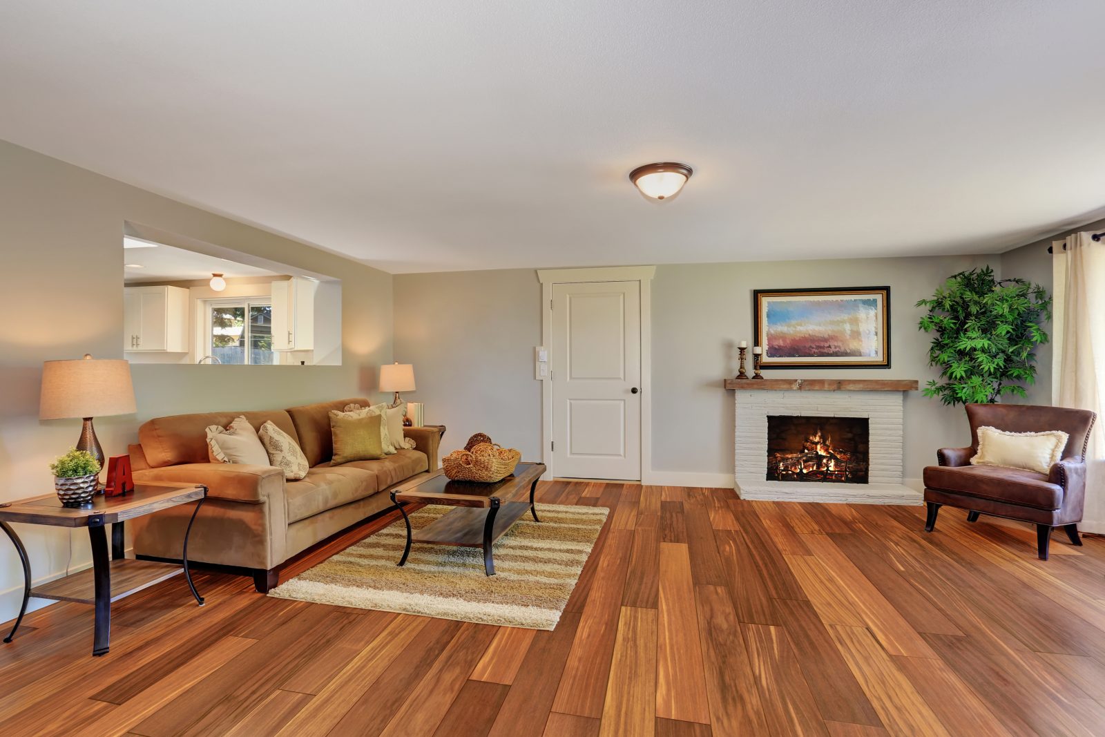 Cumaru hardwood flooring in a living room with a fireplace