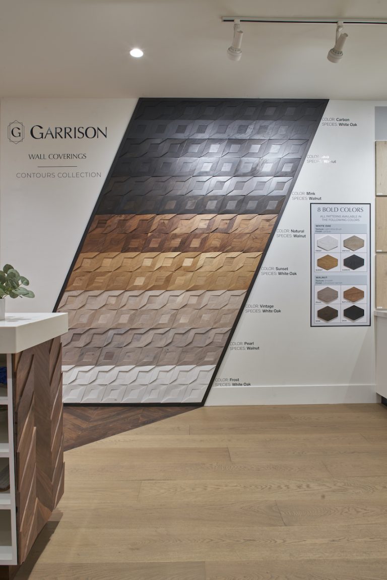 The Garrison Van Nuys showroom with flooring samples on the walls and a beautiful custom wooden floor