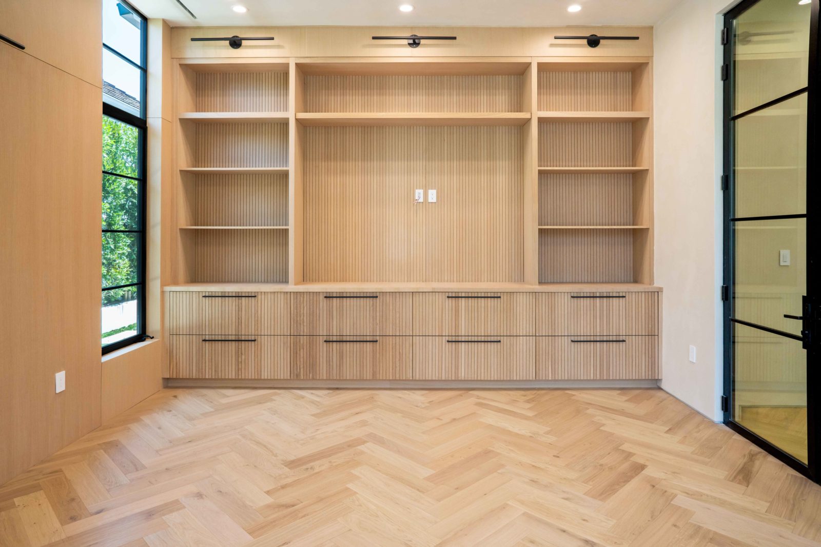Italian made light color hardwood flooring with a herringbone pattern in a modern Los Angeles house
