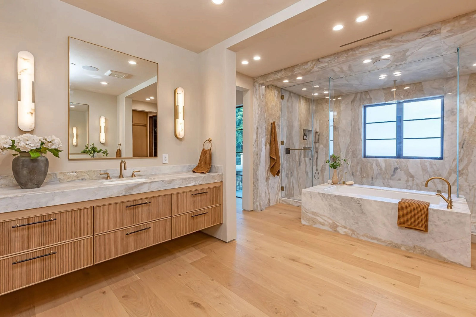 Light color Italian wide plank hardwood flooring in a beautiful modern Los Angeles home