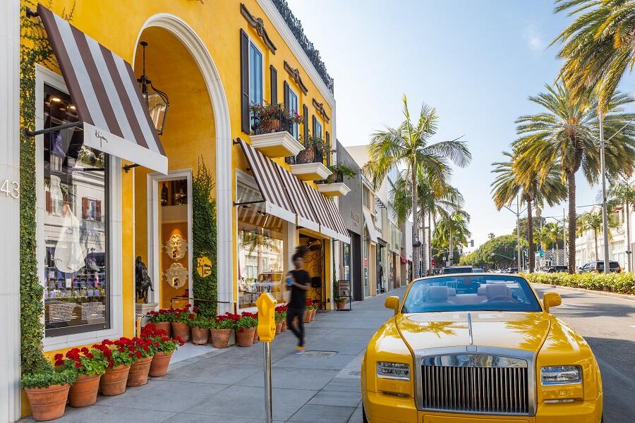 yellow car parked on rodeo drive in Beverly Hills